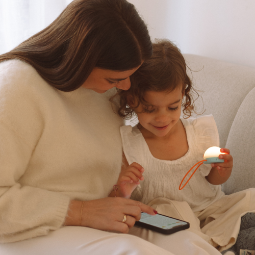 Parent setting up Snuggo in the app with her daughter